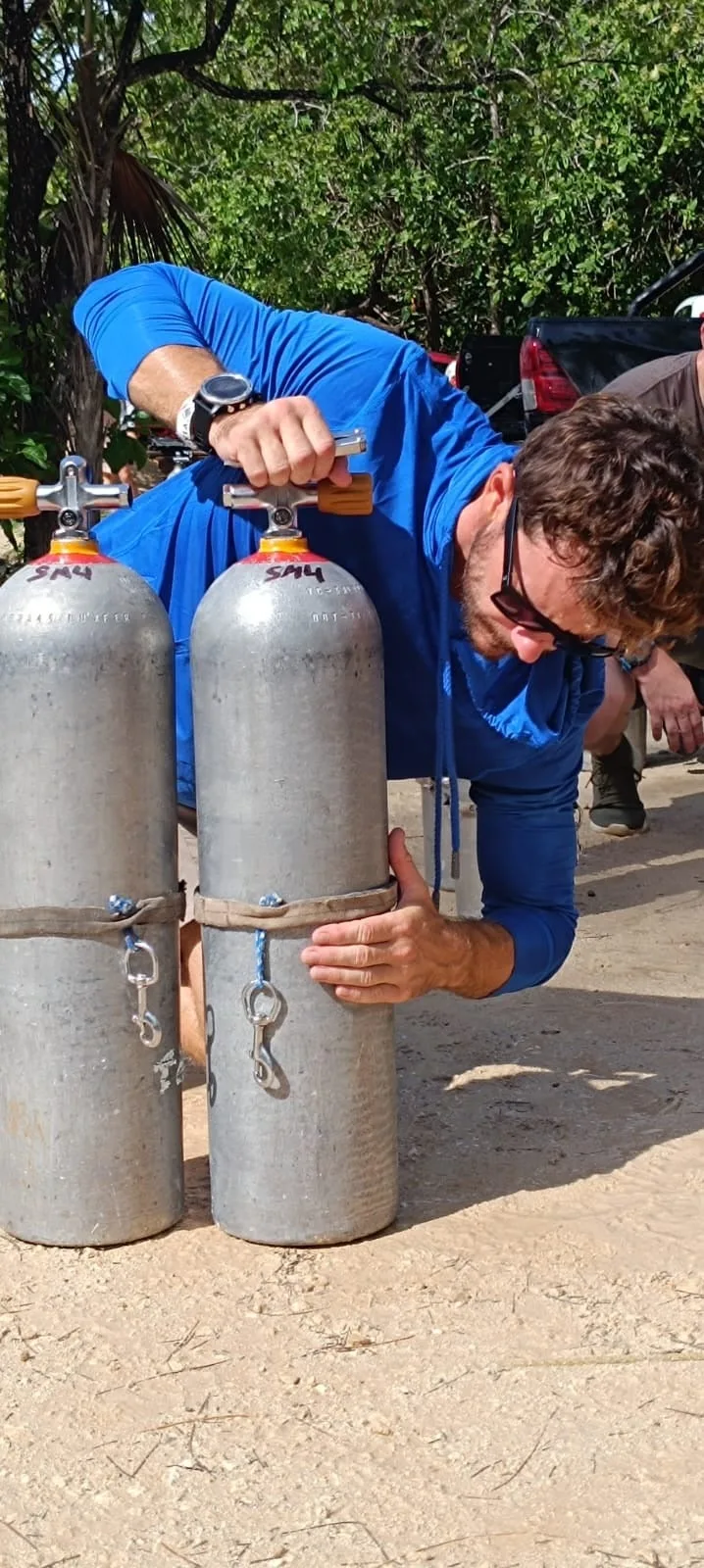 Scott Finch preparing Sidemount diving cylinders in Gran Canaria