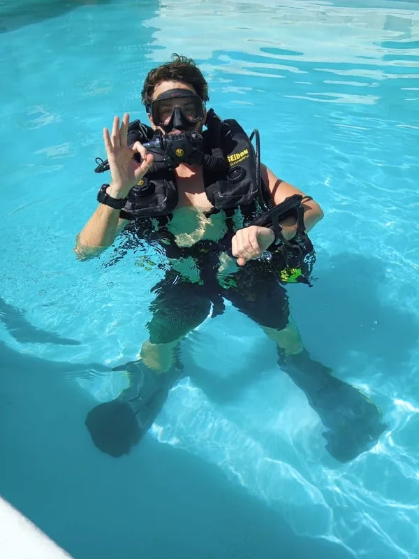 Scott Finch practising PADI Sidemount skills in a pool in Gran Canaria