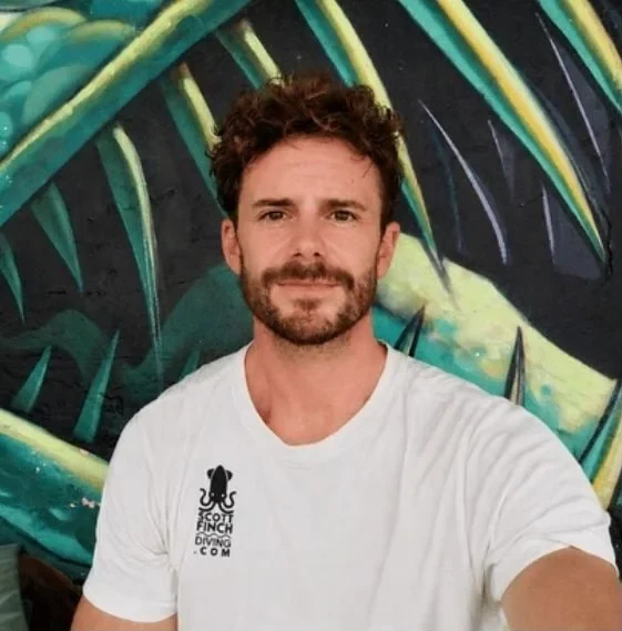 Scott Finch, independent PADI diving instructor, in his Scott Finch Diving T-shirt